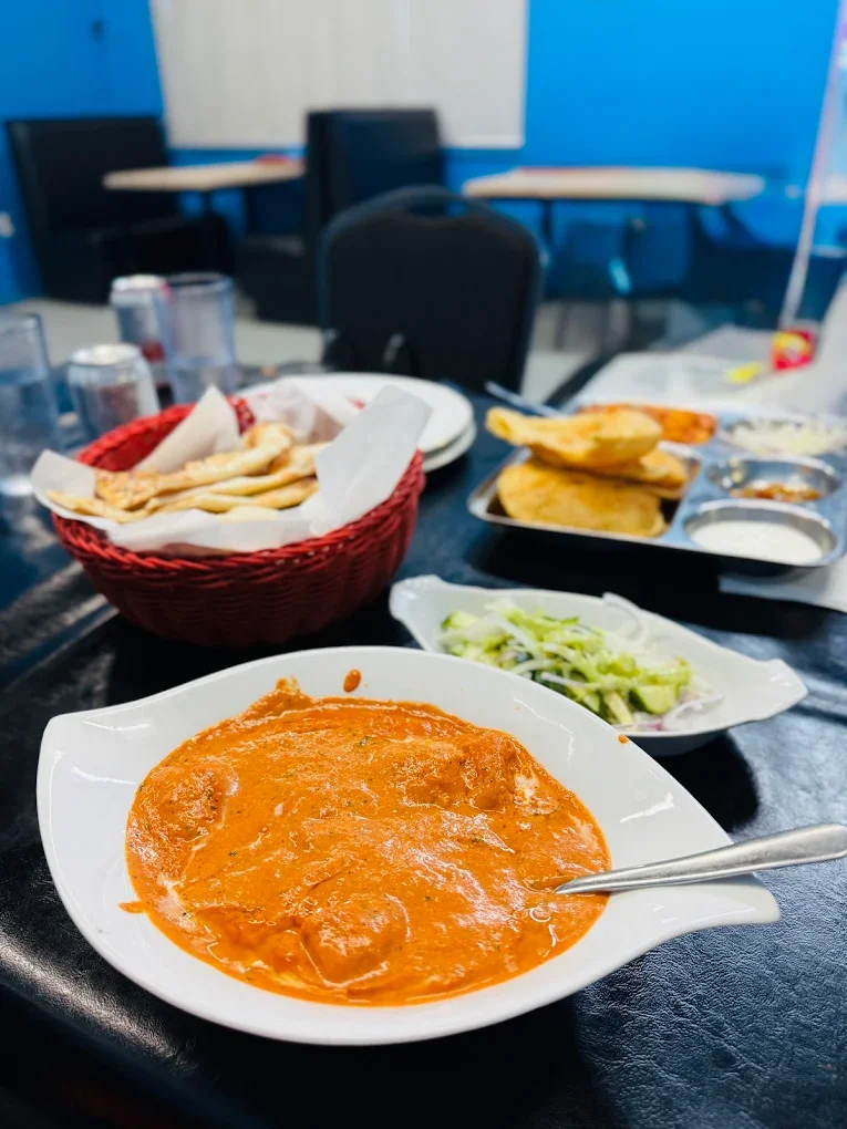 Butter chicken with fresh naan at Dynamic Duo House of Naan and Curry, Saskatoon