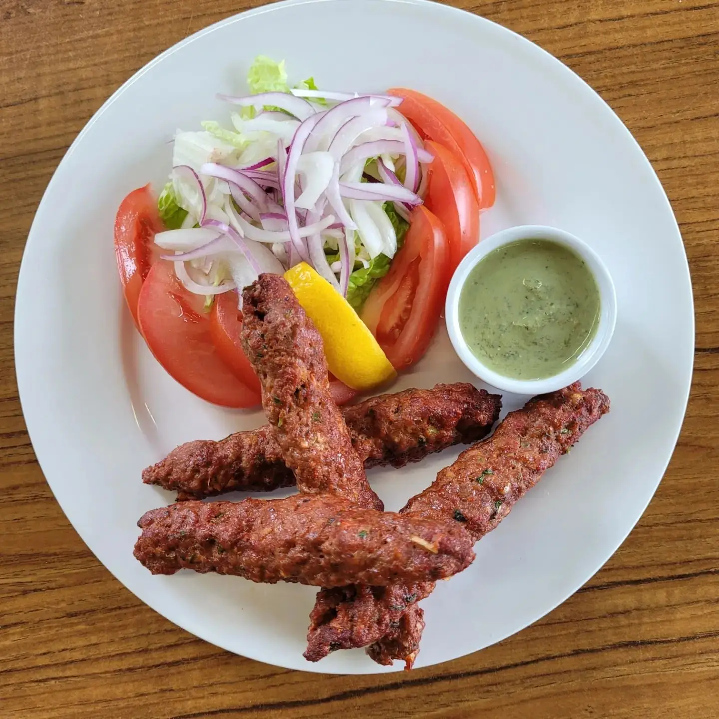 Authentic seekh kabab tandoori dish at Dynamic Duo Indian restaurant Saskatoon